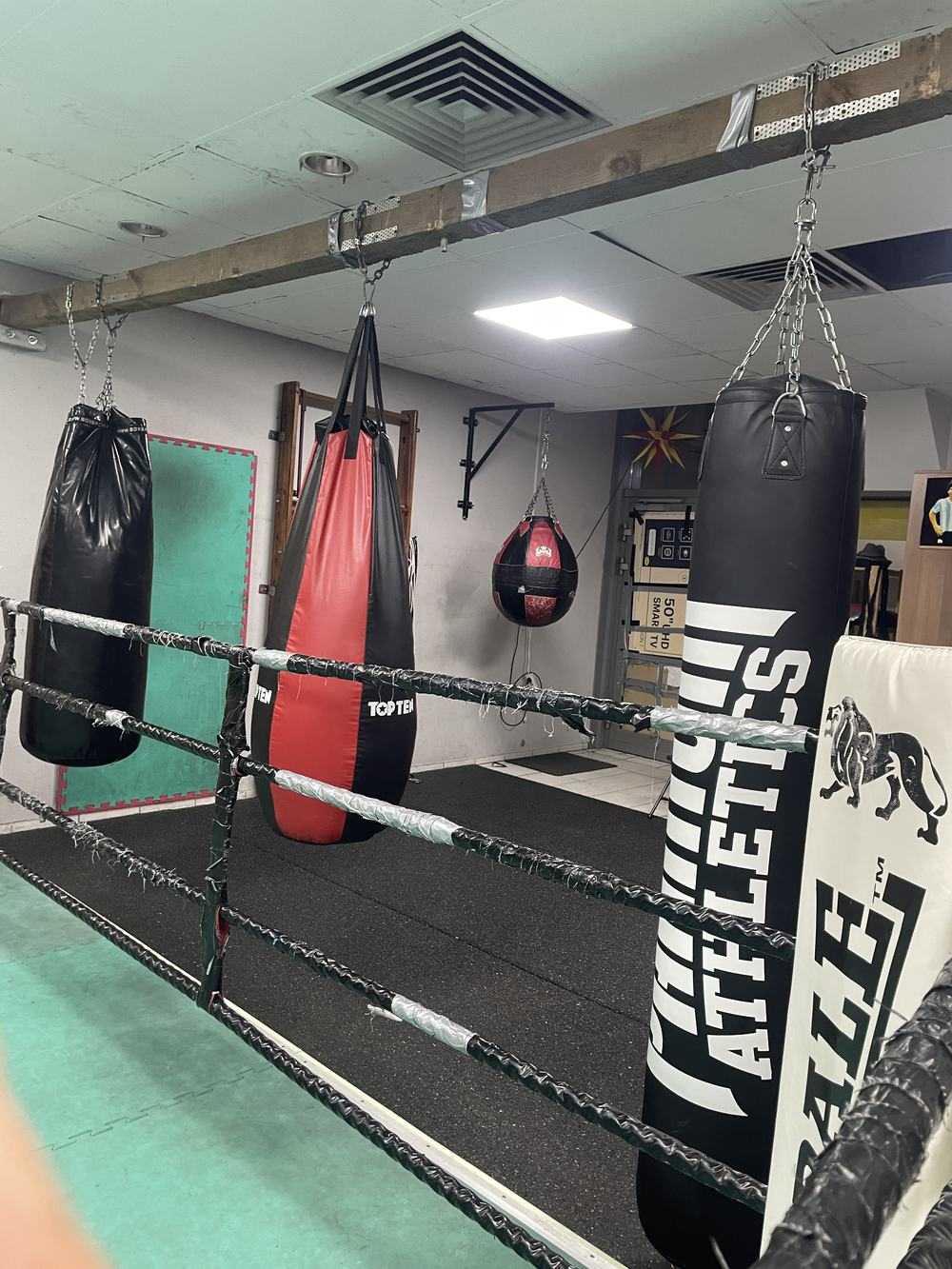 Boxing class in an indoor studio.